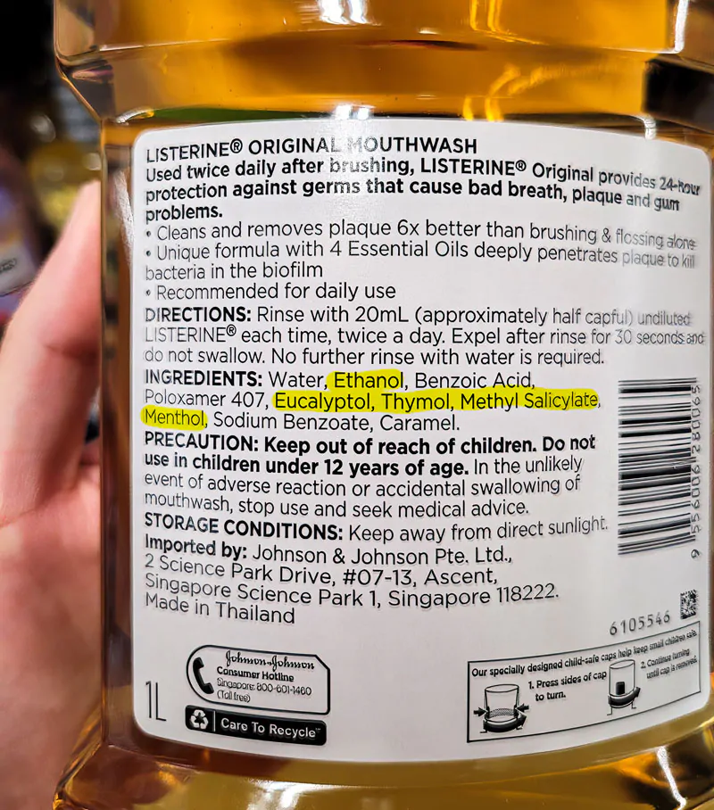 mouth rinse label containing alcohol and essential oils